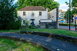 The wall at the right of the house in Phippen street where Chatterton was raised is that of the c. 1739 school where Chatterton's father was the master.