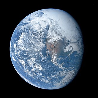 Earth famous photograph (AS16-118-18885) from Apollo 16 was taken by Charles Duke by his own account, during the trans-lunar coast, showing the US at center