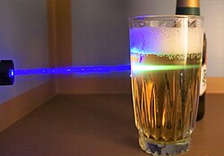Organic aromatic acids found naturally in beer, such as tryptophan, tyrosine, and phenylalanine, absorb blue light and fluoresce in green under 450 nm laser light.[160]