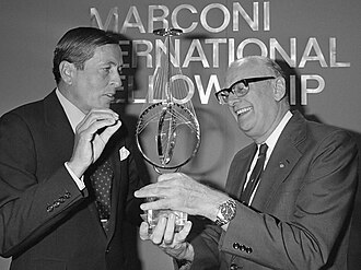 Clarke receives the Marconi International Fellowship Award from Prince Claus of the Netherlands in 1982.