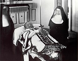 Mother Marianne Cope and Sister Leopoldina Burns beside the funeral bier of Father Damien