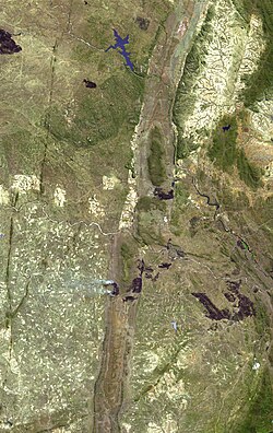Wedza Subchamber of the Great Dyke. Mimosa Platinum Mine is located near the heavily wooded section in the centre. The Umvimeela Dyke is visible to the far left of the scene.