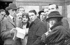 Griffith (left) on the set of The Birth of a Nation with actor Henry Walthall (center) and others