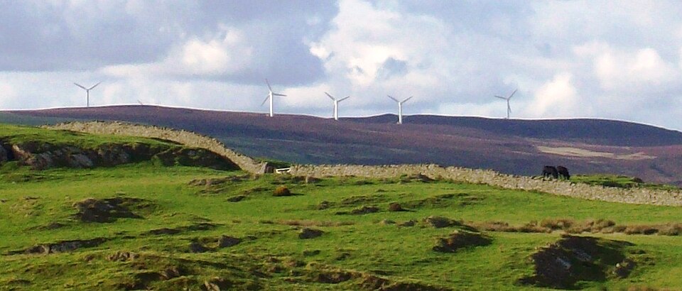 Wind turbines such as these, in Cumbria, England, have been opposed for a number of reasons, including aesthetics, by some sectors of the population.[158][159]