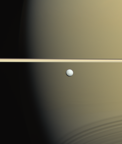 A picture of Enceladus in parallel with Saturn's ring, taken by Cassini in January 2006