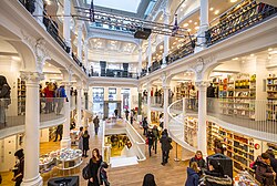 Cărturești Carusel, a bookshop in a historical building from Bucharest (Romania), built in 1860 as a bank. Its interior combines Baroque Revival architecture with modern design.