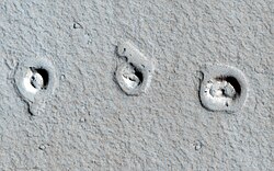 "Rootless Cones" on Mars – due to lava flows interacting with water (MRO, 4 January 2013) (21°57′54″N 197°48′25″E / 21.965°N 197.807°E / 21.965; 197.807)