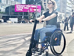 A wheelchair propelled by attached power add-on