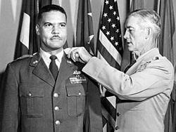 General Earle E. Partridge pinning a general's star on Davis.