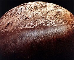 Triton's bright south polar cap above a region of cantaloupe terrain