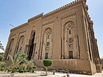 The Al-Rifa'i Mosque in Cairo, a major example of Neo-Mamluk architecture. It was begun in 1869 by Egyptian architect Husayn Fahmi Pasha and completed in 1911 by Hungarian architect Max Herz.