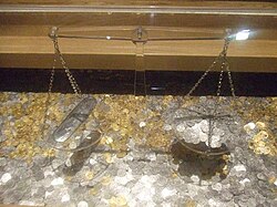 The tower pound displayed as the weight of a pound sterling of 240 early silver pennies (original pennyweight)