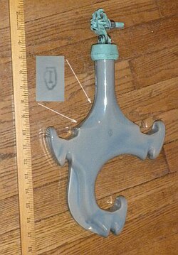 A three-phase insulator used on distribution lines, typically 13.8 kV phase to phase. The lines are held in a diamond pattern, multiple insulators used between poles.