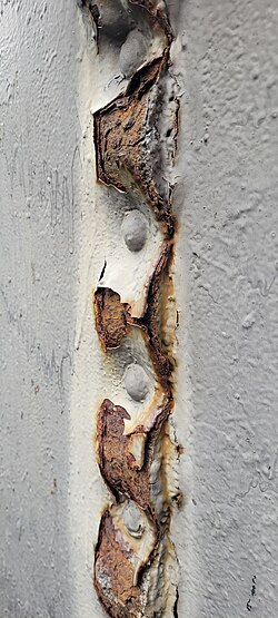 Riveted connection of elements of the cooling tower of a power plant from 1904. Increased material volume caused by corrosion.