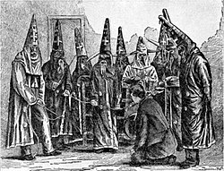 Depiction of Ku Klux Klan in North Carolina in 1870, based on a photograph taken under the supervision of a federal officer who seized Klan costumes