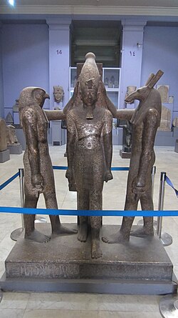 Horus (left) and Set (right) blessing Ramesses III in this statue, currently located in the Egyptian Museum.