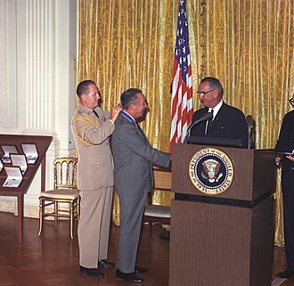 Disney receiving the Presidential Medal of Freedom in 1964 from President Lyndon B. Johnson.