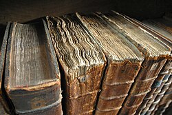 Worn books at the library of Merton College, Oxford