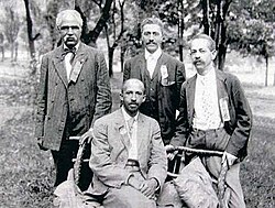Niagara Movement leaders W. E. B. Du Bois (seated), and (left to right) J. R. Clifford, L. M. Hershaw, and F. H. M. Murray at Storer College in 1906.