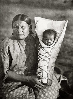 Comanche mother and baby son in cradleboard, photo by Edward Curtis