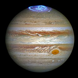 Jupiter's auroras reveal the planet's super-rotational atmospheric dynamics. With the different shades of color and depths of the clouds, the ethereal glow highlights the planet's rapid atmospheric movements.