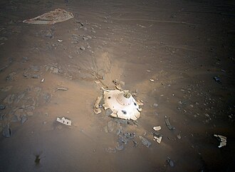 Perseverance's backshell sitting upright on the surface of Jezero Crater