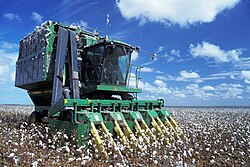 Mechanized agriculture: from the first models in the 1940s, tools like a cotton picker could replace 50 farm workers, at the price of increased use of fossil fuel.
