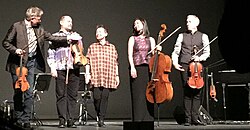 Anderson with the Kronos Quartet, after performing Landfall at the Harris Theater in Chicago, 2015