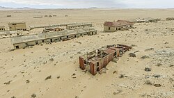Sand-filled rooms inside abandoned buildings at Kolmanskop