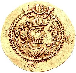A coin of Sassanid king Kavadh I during his second reign (r. 488–531). Kavadh was the first Sassanid ruler to introduce star-and-crescent motifs as decorations on the margin of the obverse side of his coins. Note the continued use of the star and the crescent appearing on either side of the king's head.
