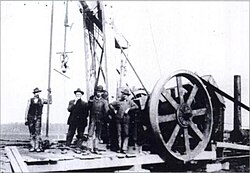 Natural gas miners and their drill, near Kokomo, Indiana during the Indiana Gas Boom, c. 1885