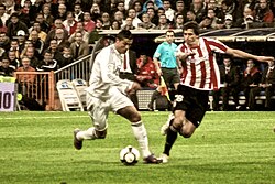 Real Madrid's Cristiano Ronaldo (left) and Athletic Bilbao's Ander Iturraspe during a match at Santiago Bernabéu Stadium, 2010