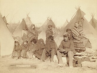 Survivors of Wounded Knee Massacre, 1891 (Title: What's left of Big Foot's band). John C. Grabill.