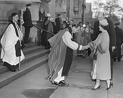 Bishop Horace W. B. Donegan greets Queen Elizabeth The Queen Mother on the steps of the cathedral on the day of the Columbia University Bicentennial, October 31, 1954.