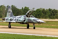 A Royal Thai Air Force Northrop F-5E Tiger II (USAF s/n 76-1673) taxies on the flight line at Korat