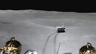 The ground surface of the lunar far side with the Yutu-2 rover (center), captured by the Chang'e 4 lander.