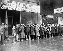 Unemployed men queued outside a depression soup kitchen opened in Chicago, Illinois by infamous gangster Al Capone, February 1931