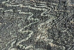 Tightly folded serpentinite from the Tux Alps, Austria. Closeup view about 30 cm × 20 cm (12 in × 8 in).
