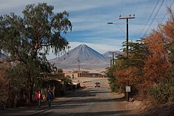 Licancabur seen from a tree-lined town road