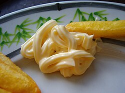 Mayonnaise from the Zaan district, North Holland, Netherlands and potato fries, though a mayonaise variety called frietsaus is more frequently used on French fries.