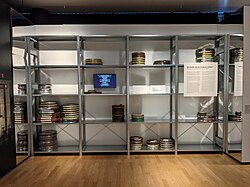 Simulation of a film archive: the shelves have been left almost empty to help visitors better visualize the gap between the number of surviving films and the number of films actually made.