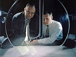 NASA Researchers view a demonstration of the moon dust simulator in the 8- by 6-Foot Supersonic Wind Tunnel facility at the NASA Lewis Research Center (1960).