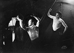 Stokers in the boiler room on board HMT Stella Pegasi, Scapa Flow, 6 June 1943