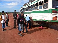 Miskito people changing a bus tire between Bilwi and Krukira, Nicaragua
