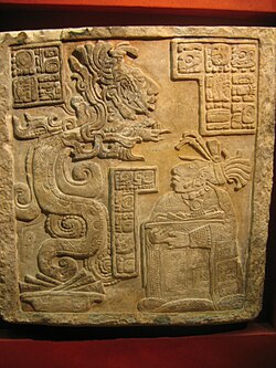 Lintel stone from Yaxchilan depicting a man emerging from the mouth of a vision serpent.