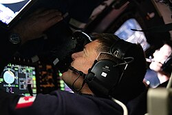 Hansen, seen taking images through an Orion spacecraft window early in the 2026 Artemis II lunar flyby
