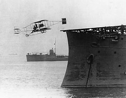 Eugene Burton Ely making the first shipboard takeoff from the USS Birmingham in 1910