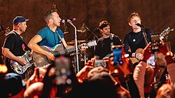 Sheeran (right) on stage with Coldplay at the O2 Shepherd's Bush Empire, west London in October 2021