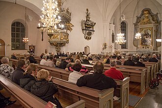 Mass being celebrated on All Saints' Day at Hedemora Evangelical-Lutheran Church in Sweden