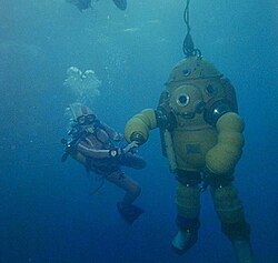 Two very different modes of diving: Ambient pressure open circuit scuba diving (left) and atmospheric pressure diving in a pressure resistant suit (right)